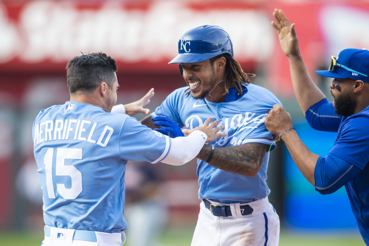 Apr 9, 2022; Kansas City, Missouri, USA; Kansas City Royals shortstop Adalberto Mondesi (27) celebrates with teammates after hitting the game winning RBI in the 10th inning against the Cleveland Guardians at Kauffman Stadium. Mandatory Credit: Nick Tre. Smith (FLO)-USA TODAY Sports